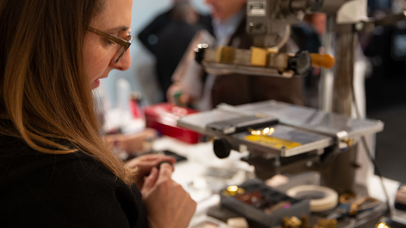 Woman making a leather stamp