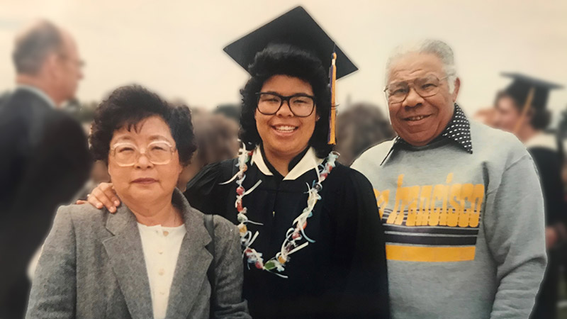 Patty Dingle on graduation day with her parents