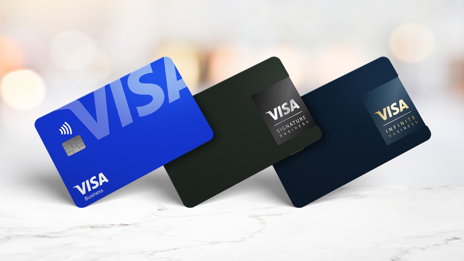 Traditional, Signature, and Infinite business credit cards with Visa logos.