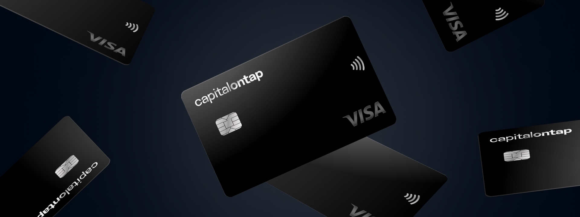 Image of credit cards falling at different angles. Cards have the capitalontap logo, Visa logo, the tap to pay logo, and have embedded chips.