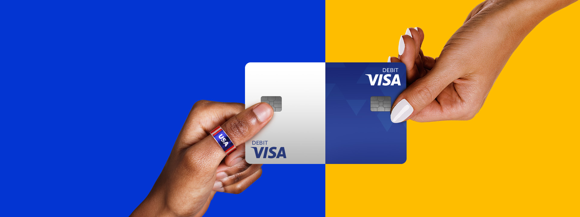 Two hands holding a Visa Debit card.