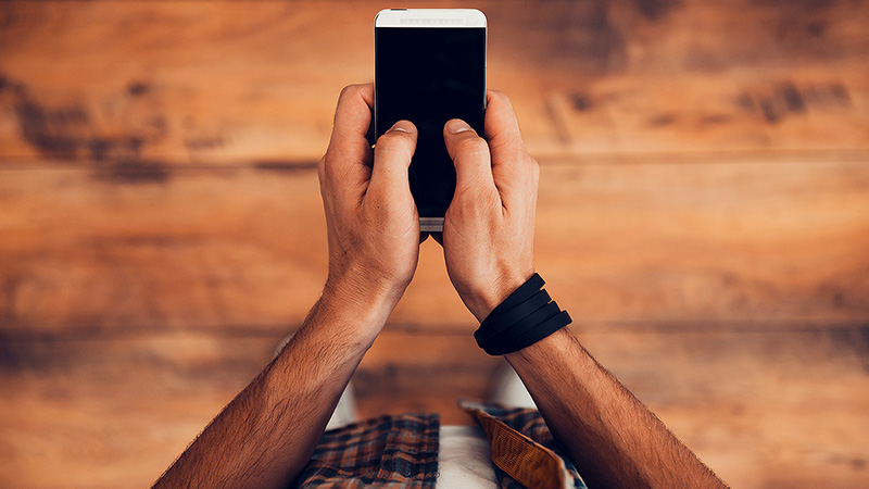 Hands holding a phone. Hands holding a phone.