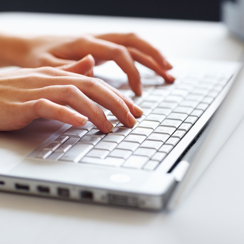 Man checking report on laptop