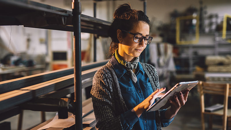 working professional holding a tablet