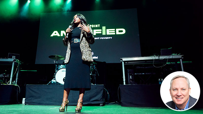 A woman (Adama Iwu) talks into a microphone on stage at the Tipping Point Amplified event. Inset image of blog author (Bill Sheedy).