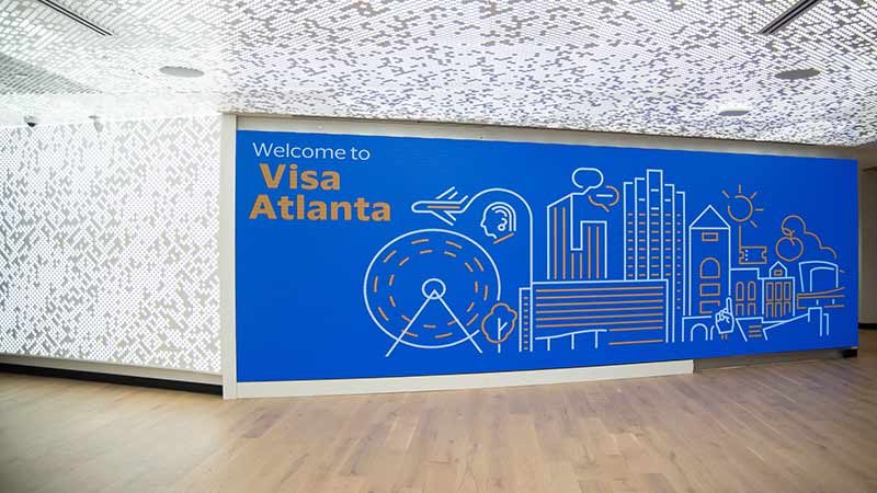 Lobby of Visa's Atlanta office with Welcome to Visa Atlanta digital sign.