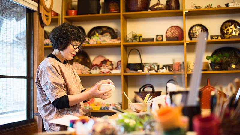 restaurant owner/chef preparing a meal