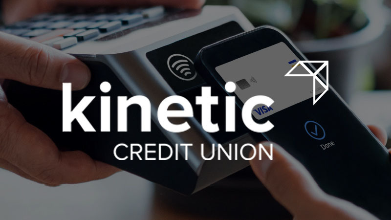 image of a person holding a smartphone up to a card reader with the Kinetic Credit Union logo overlaid on it