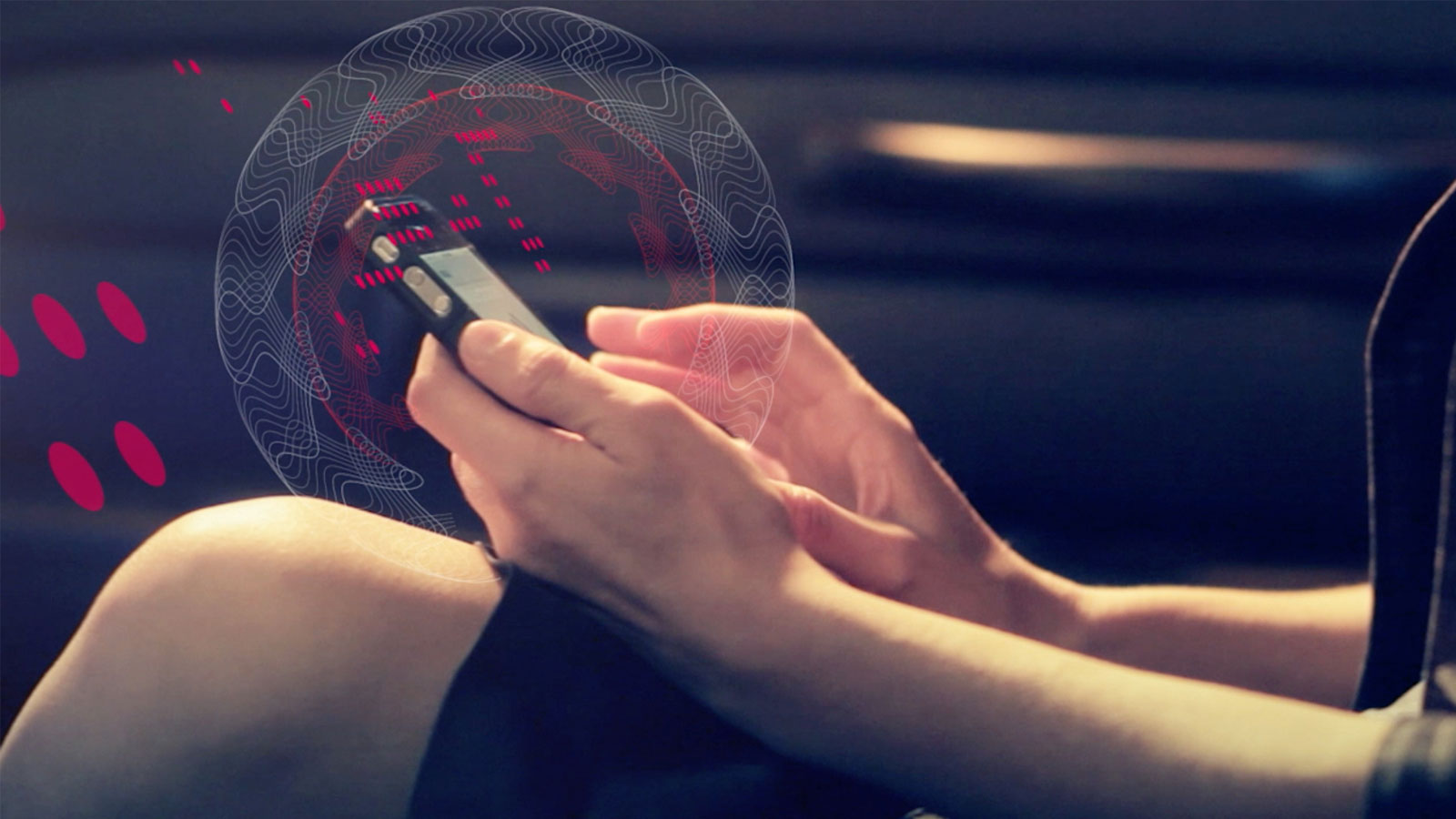 A person holding a mobile phone. A person holding a mobile phone.