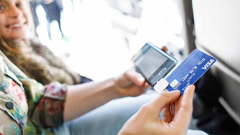 taxi-swipe-square-800x450 Taxi driver swiping Visa card from a customer.