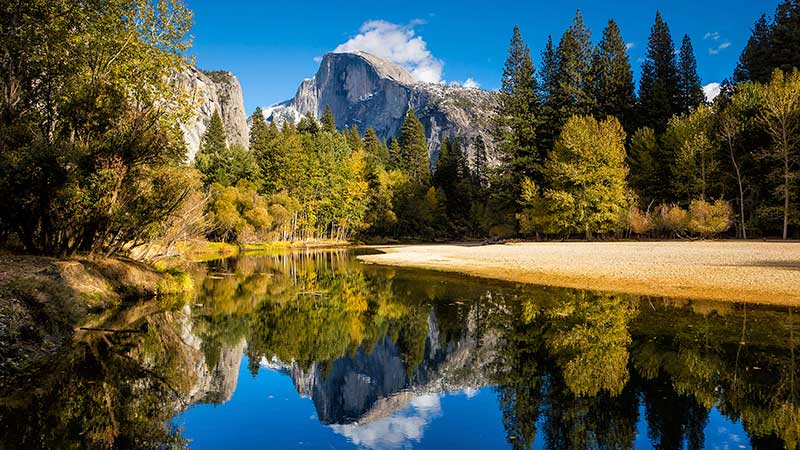 View of lake, trees and mountain. View of lake, trees and mountain.
