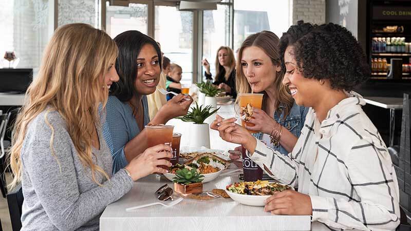 Women eating Mediterranean food at a restaurant. Women eating Mediterranean food at a restaurant.