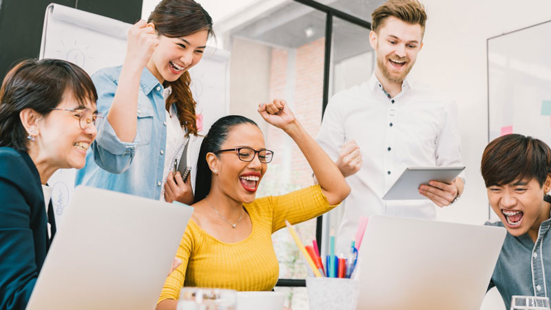 office team celebrating their work success