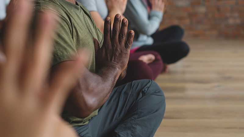 People doing yoga in a studio People doing yoga in a studio
