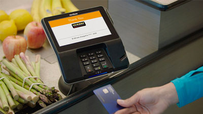 Customer removes card from chip reader in payment terminal. 