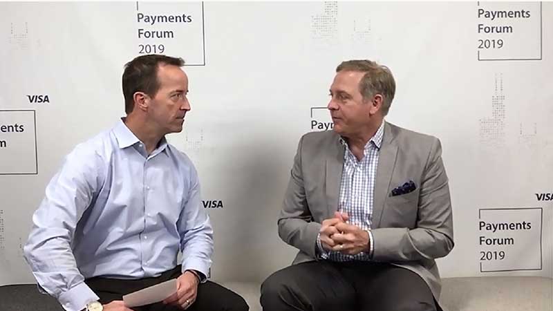 Doug Leighton talking to an interviewer at the Visa Payments Forum 2019.