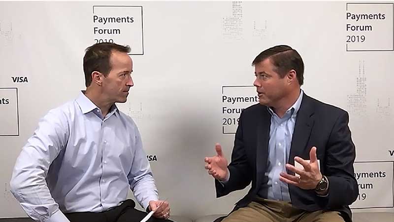 Tom Brooks talking to an interviewer at the Visa Payments Forum 2019.