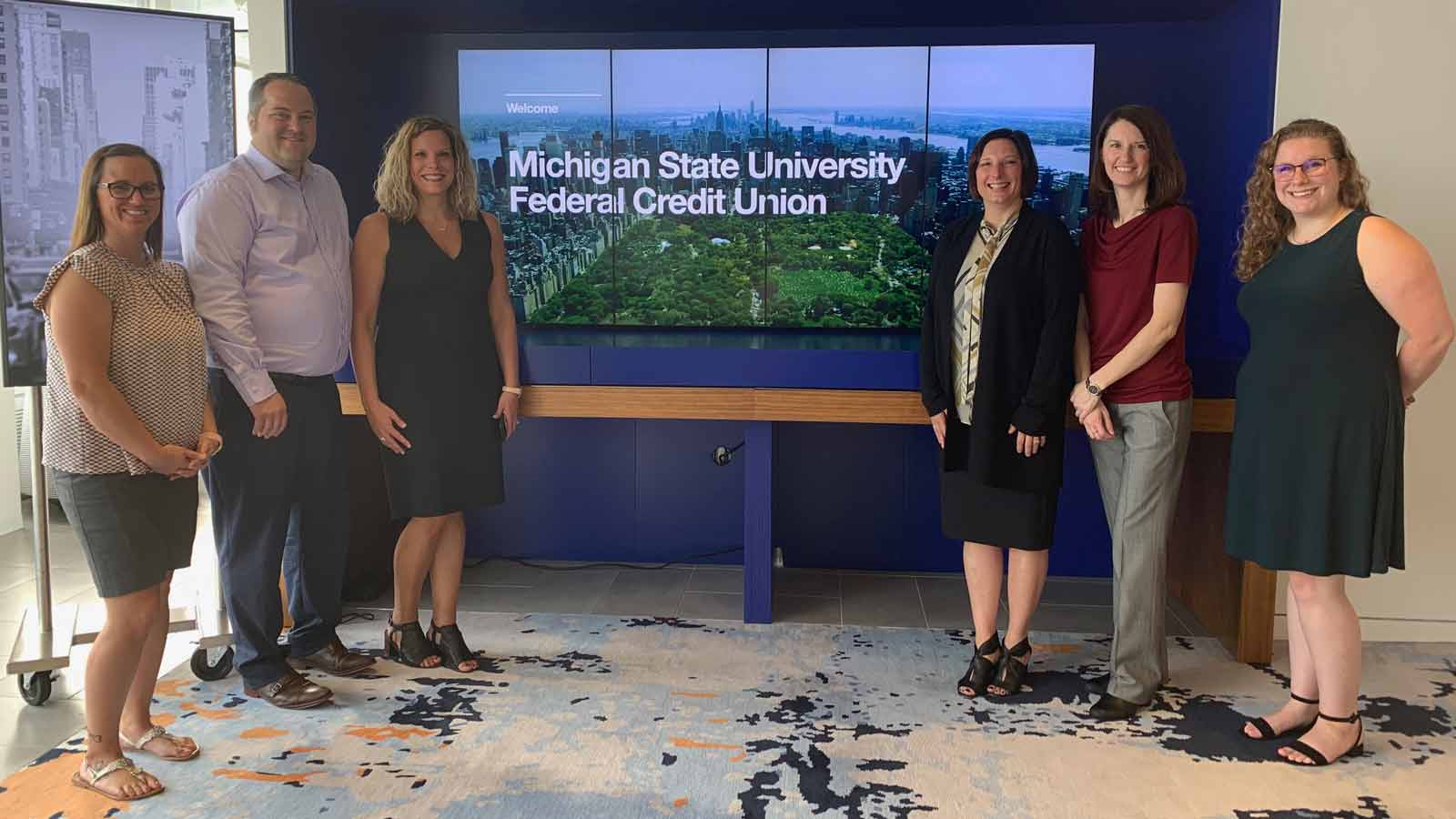 Screen showing image of New York City and the name 'Michigan State University Federal Credit Union' flanked by the six winners from there.