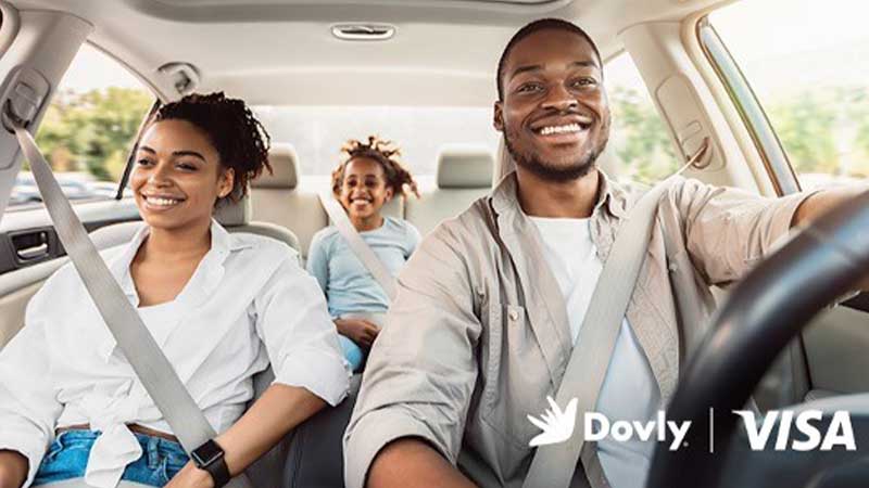 Three people inside a car with seatbelts buckled and the Dovly and Visa logos.