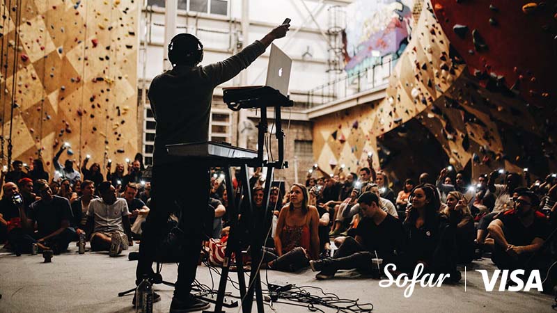 Image of DJ and crowd with Sofar and Visa logos in the corner